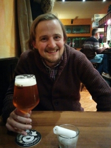 George drinking beer in Milan