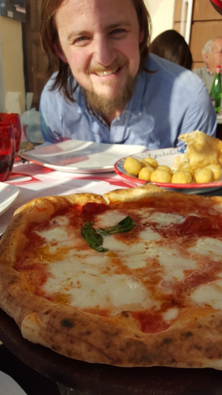George overseeing a plate of frittura (fried starters) and pizza at La Dea Bandata